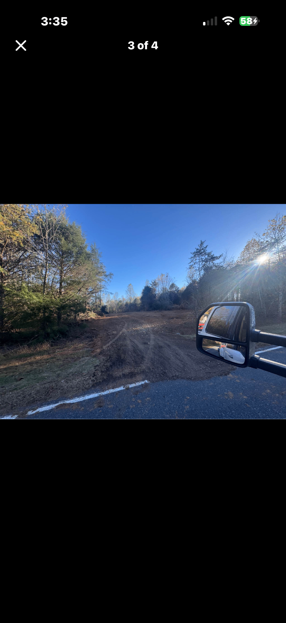 Cleared road frontage with truck mirror — North Carolina